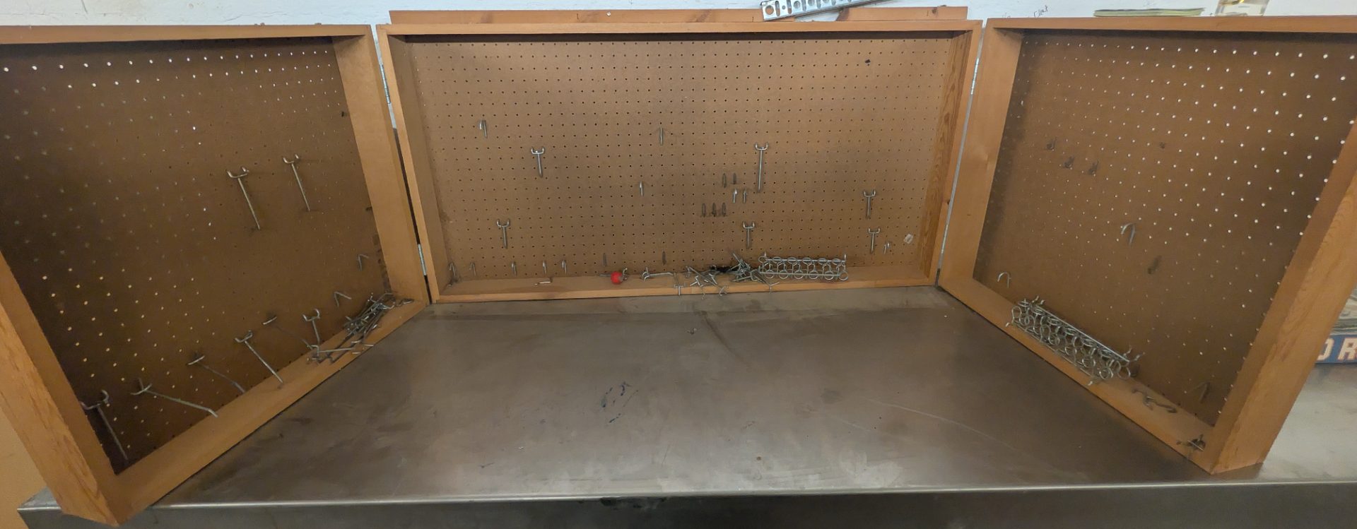 Wood Wall-Mount Pegboard Storage Cabinet with Sliding Doors and Wire Basket — photo 2