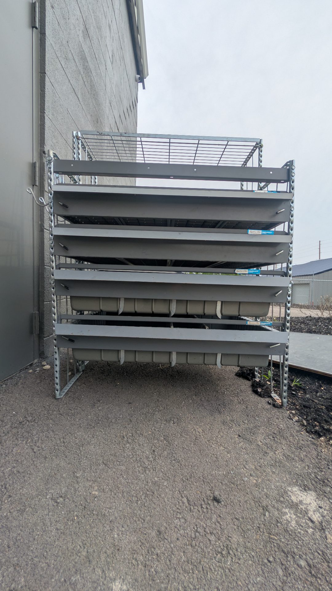 Multi-Tier Retail Gondola Shelving Unit with Gravity-Feed Plastic Trays & Wire Basket — Lozier/Madix Compatible