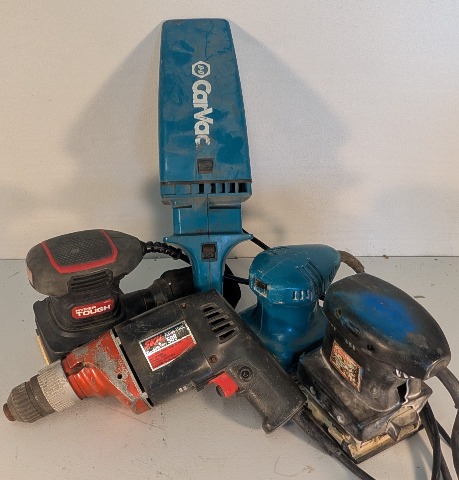 Mixed Corded Power Tool Lot with Makita Case, Milwaukee Drill, and Sanders